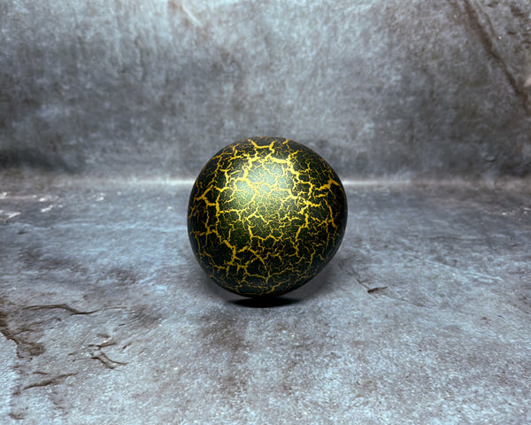 Coconut shell with green and gold